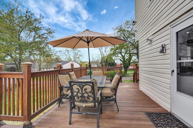 wooden terrace featuring outdoor dining space