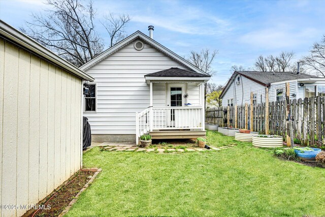 274 Prospect Ave, Old Bridge, NJ 08857 - rear view of house with a vegetable garden and roof with shingles