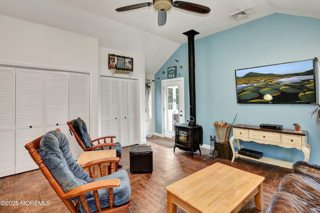 274 Prospect Ave, Old Bridge, NJ 08857 - living area featuring a wood stove, vaulted ceiling, and a ceiling fan