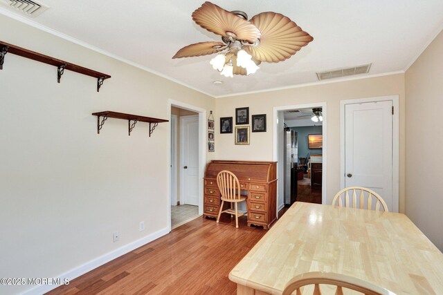 274 Prospect Ave, Old Bridge, NJ 08857 - dining room with ceiling fan, light wood finished floors, and crown molding