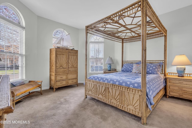 carpeted bedroom featuring baseboards