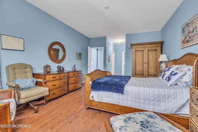 bedroom featuring light wood-style flooring