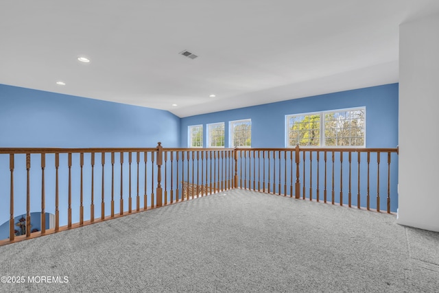 corridor with visible vents, recessed lighting, and carpet floors