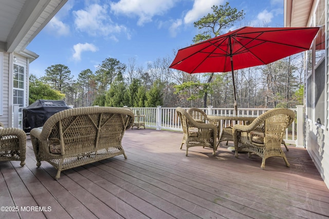 wooden terrace with a grill