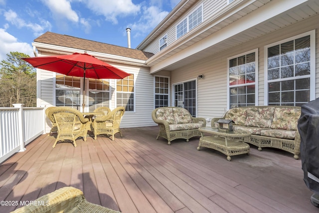 wooden deck with an outdoor living space and outdoor dining area