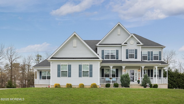view of front of house with roof with shingles, a front lawn, and covered porch