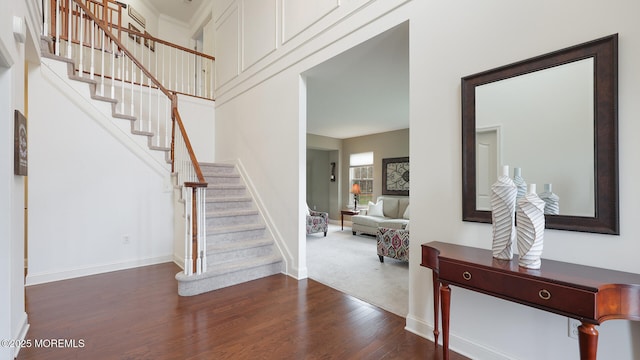 interior space with wood finished floors and baseboards