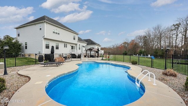 view of swimming pool with a gazebo, a yard, a patio area, and a fenced in pool