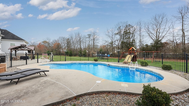 view of pool featuring a fenced in pool, a playground, fence, a patio area, and a gazebo