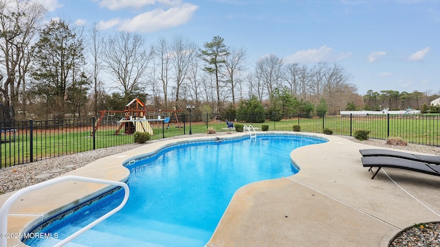 view of swimming pool with a patio area, fence, a yard, and a fenced in pool