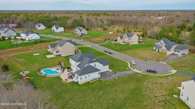 aerial view with a residential view and a wooded view