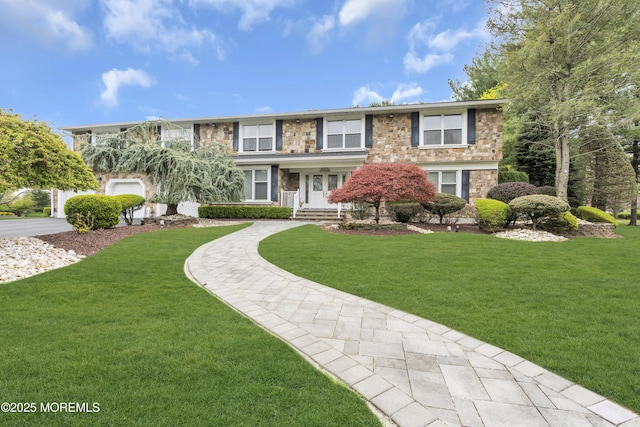 view of front of property with a front lawn and stone siding
