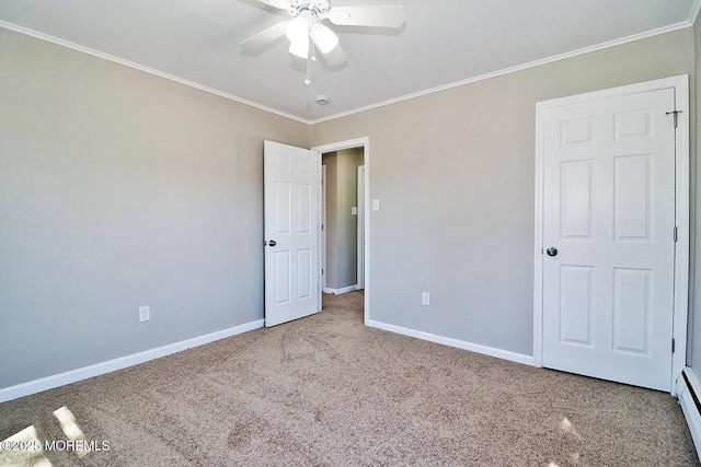 unfurnished bedroom featuring crown molding, carpet flooring, baseboards, and baseboard heating