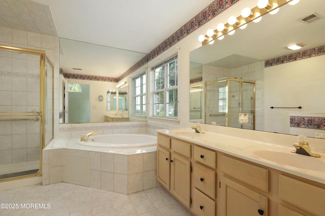 bathroom with a garden tub, visible vents, tile patterned flooring, a stall shower, and a sink