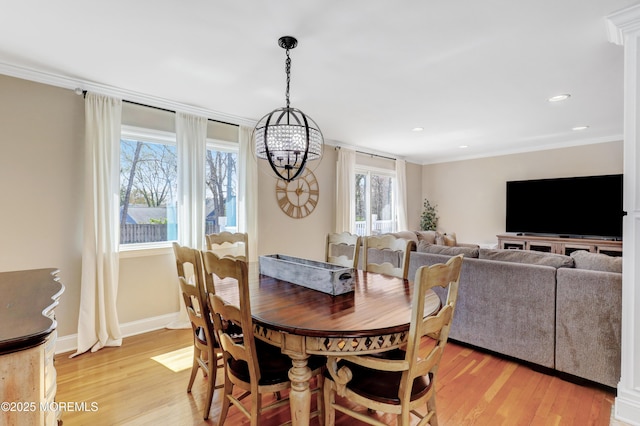 dining area featuring recessed lighting, light wood-style floors, baseboards, and ornamental molding