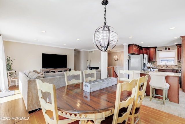 dining room featuring recessed lighting, visible vents, crown molding, and an inviting chandelier