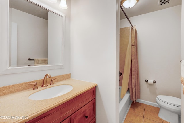 full bathroom featuring tile patterned flooring, visible vents, toilet, vanity, and shower / bath combo with shower curtain