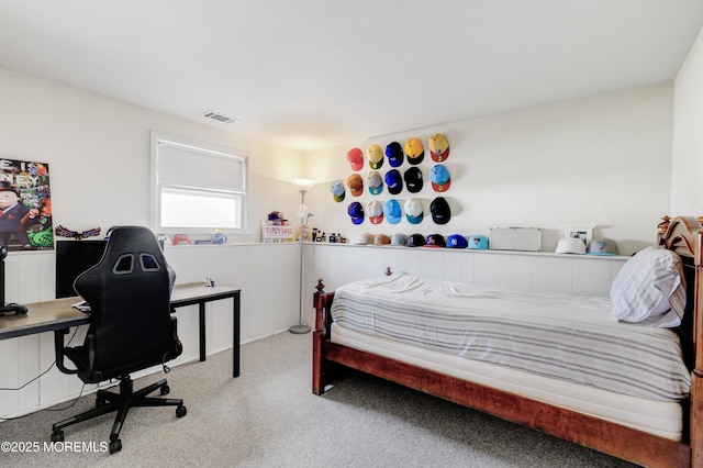 carpeted bedroom featuring visible vents