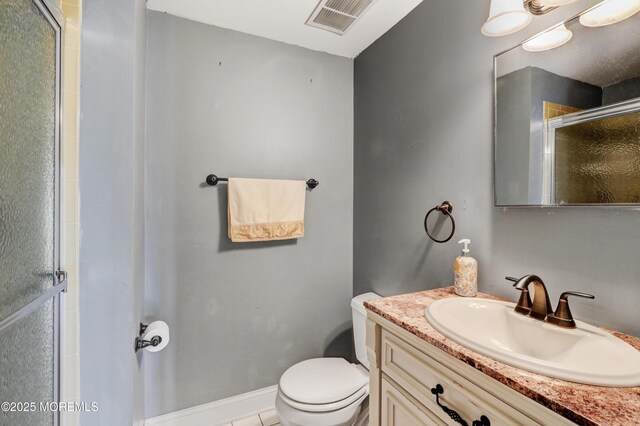 full bath with vanity, visible vents, a shower stall, and toilet