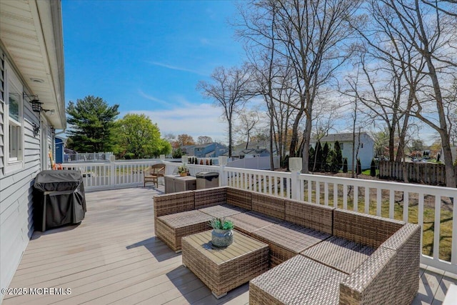 wooden terrace with area for grilling, fence, a residential view, and an outdoor hangout area