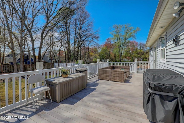 deck with fence, outdoor lounge area, and a grill