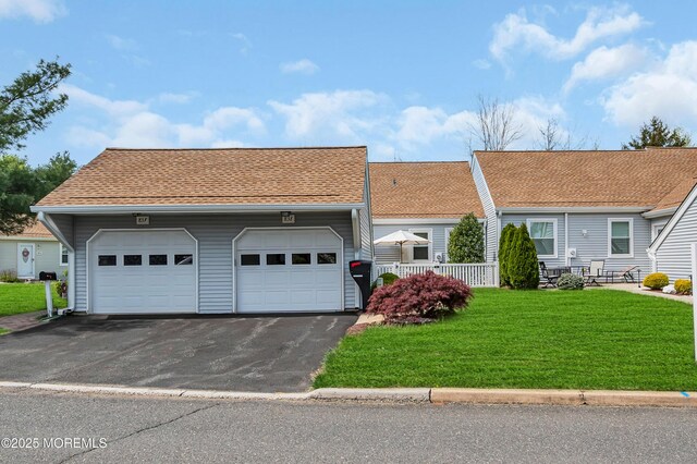 83 Parkway Dr Unit E, Freehold, NJ 07728 - single story home with a shingled roof, driveway, and a front yard