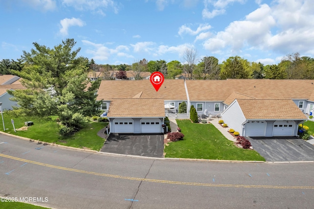 83 Parkway Dr Unit E, Freehold, NJ 07728 - view of front facade with a garage, driveway, and a front lawn