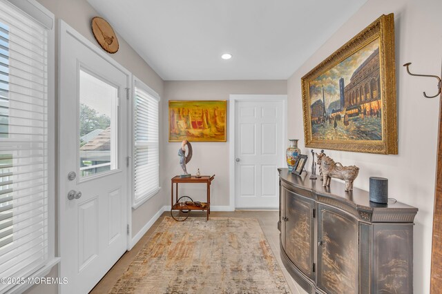 83 Parkway Dr Unit E, Freehold, NJ 07728 - doorway to outside featuring baseboards, recessed lighting, and light tile patterned flooring