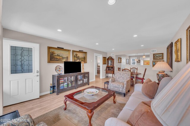 83 Parkway Dr Unit E, Freehold, NJ 07728 - living area featuring visible vents, recessed lighting, light wood-style floors, and baseboards