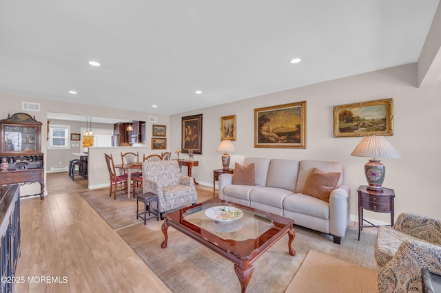 83 Parkway Dr Unit E, Freehold, NJ 07728 - living area featuring light wood-style floors, baseboards, recessed lighting, and visible vents