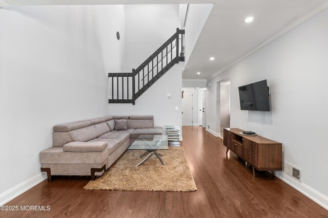 21 Spring Ct, Tinton Falls, NJ 07724 - living room featuring crown molding, baseboards, dark wood-style flooring, and stairs