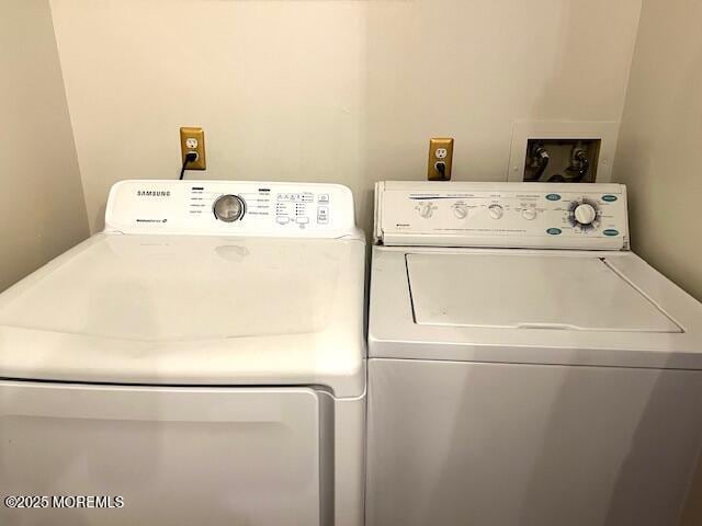 laundry room featuring washer and clothes dryer and laundry area