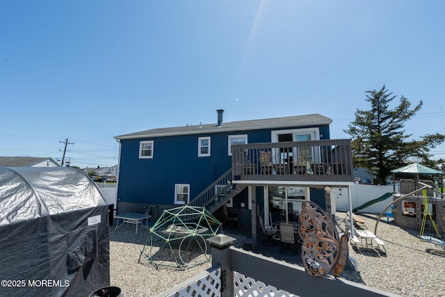 3124 Stanley Dr, Toms River, NJ 08753 - rear view of house featuring a playground, a fenced backyard, stairs, a wooden deck, and a patio area