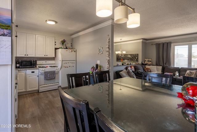 3124 Stanley Dr, Toms River, NJ 08753 - kitchen featuring white appliances, a textured ceiling, ornamental molding, white cabinetry, and open floor plan