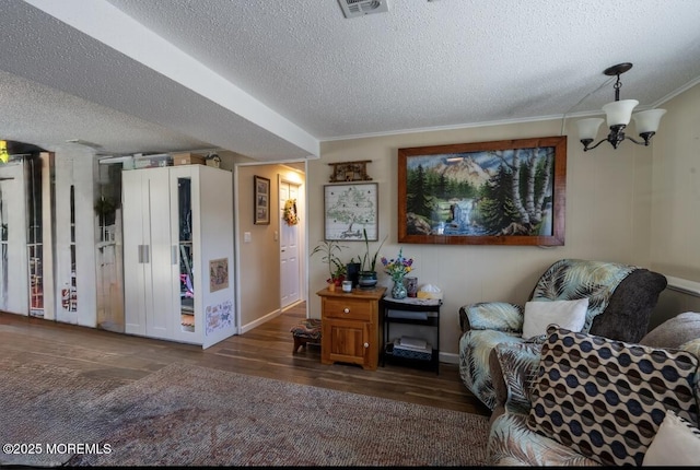 3124 Stanley Dr, Toms River, NJ 08753 - sitting room featuring a textured ceiling, wood finished floors, a chandelier, crown molding, and baseboards