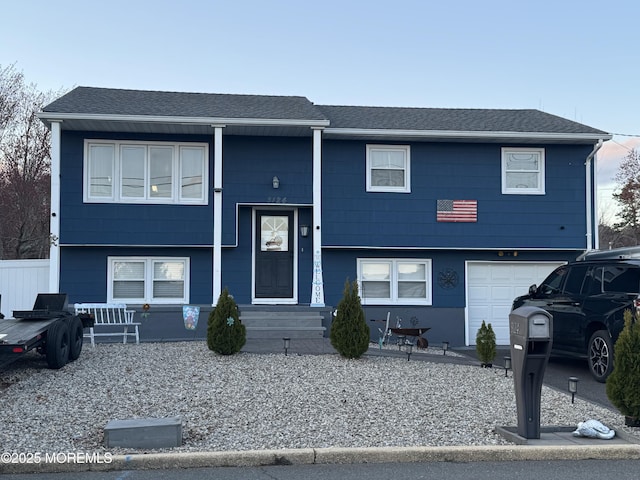 3124 Stanley Dr, Toms River, NJ 08753 - bi-level home with an attached garage and roof with shingles