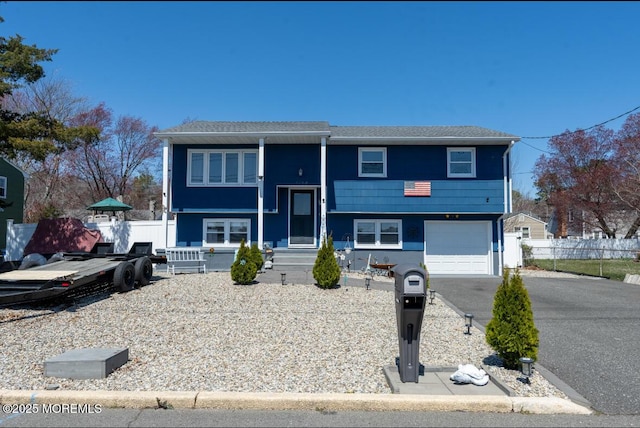 3124 Stanley Dr, Toms River, NJ 08753 - bi-level home featuring asphalt driveway and an attached garage