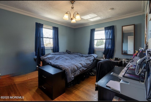 3124 Stanley Dr, Toms River, NJ 08753 - bedroom featuring a chandelier, multiple windows, crown molding, light wood-style flooring, and a textured ceiling