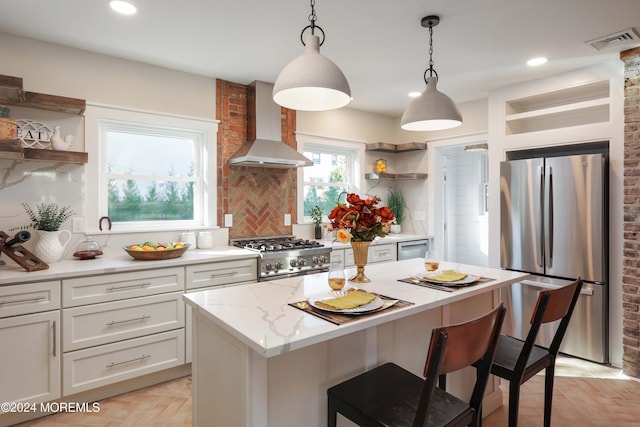 kitchen featuring visible vents, white cabinetry, wall chimney range hood, open shelves, and appliances with stainless steel finishes