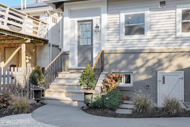 property entrance with fence