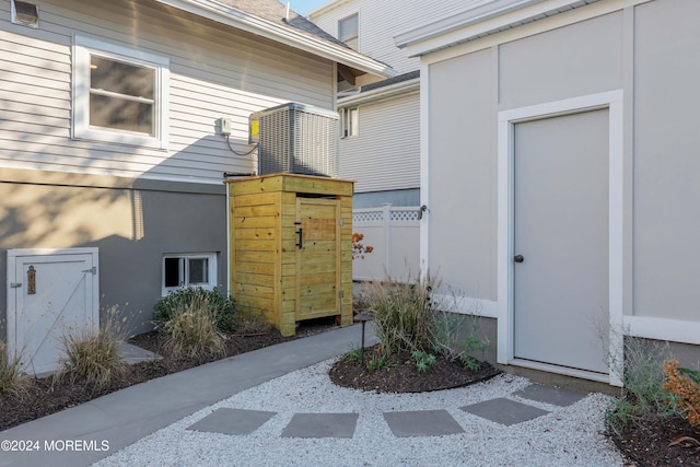 doorway to property featuring fence