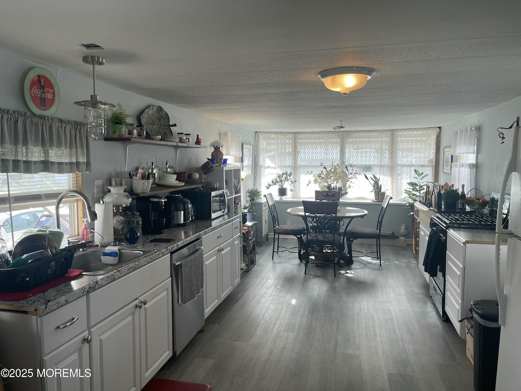 54 Alissa Ter, Jackson, NJ 08527 - kitchen with stainless steel appliances, wood finished floors, visible vents, a sink, and white cabinetry