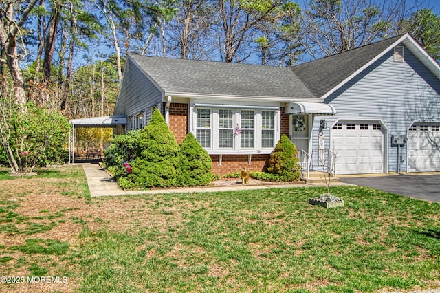 view of front facade with brick siding, driveway, roof with shingles, a front lawn, and an attached garage