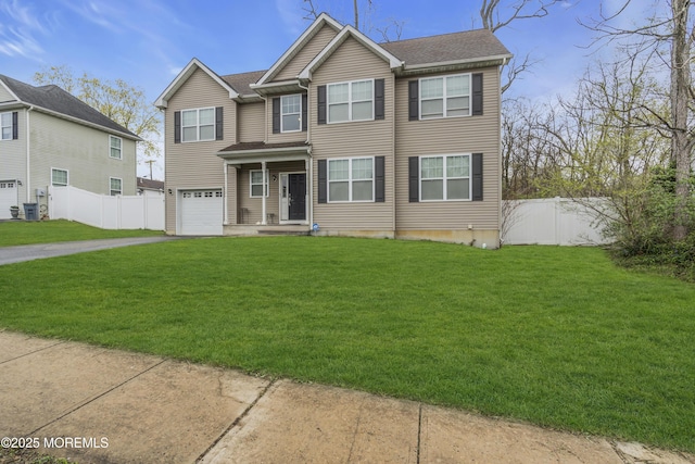 89 Orchard St, Freehold, NJ 07728 - view of front of home with an attached garage, aphalt driveway, a front yard, fence, and a shingled roof