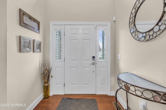 89 Orchard St, Freehold, NJ 07728 - foyer featuring dark wood-type flooring and baseboards