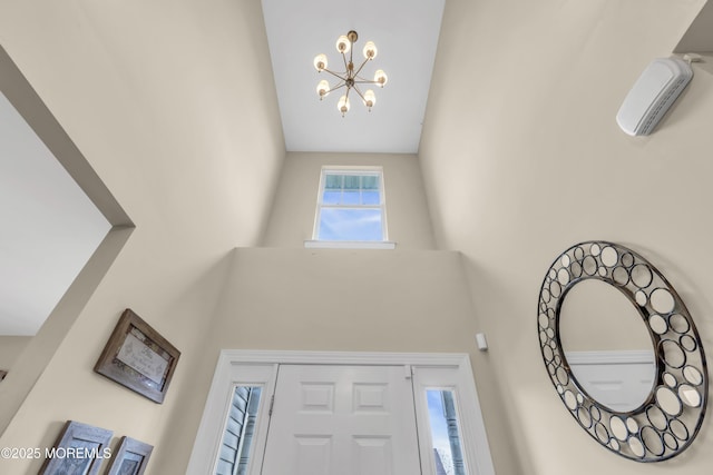 89 Orchard St, Freehold, NJ 07728 - entrance foyer featuring a high ceiling and an inviting chandelier