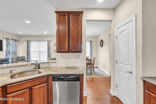 89 Orchard St, Freehold, NJ 07728 - kitchen with stainless steel dishwasher, a healthy amount of sunlight, a sink, and wood finished floors