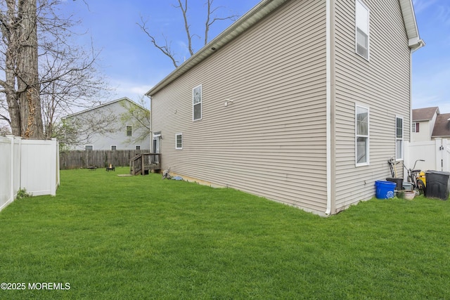 89 Orchard St, Freehold, NJ 07728 - view of property exterior with a yard and a fenced backyard