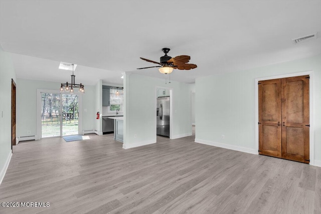 unfurnished living room featuring visible vents, light wood-type flooring, baseboards, a baseboard radiator, and ceiling fan with notable chandelier