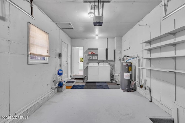garage featuring washer and dryer, a garage door opener, and electric water heater
